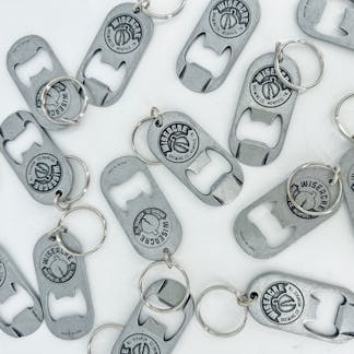 a cluster of silver metal bottle opener key chains with the wiseacre logo stamped into them