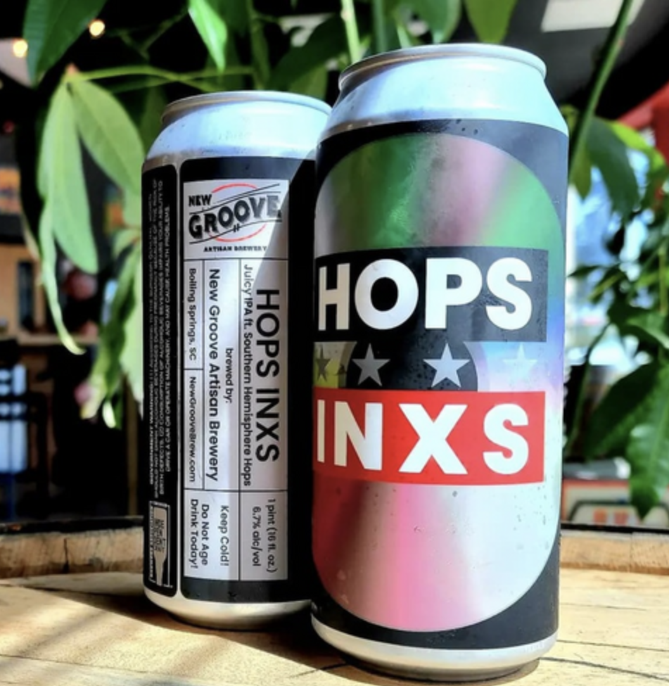 Four pack of the hops beer sitting on table