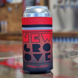 Can of beer sitting on table in a square logo cozzie from new groove