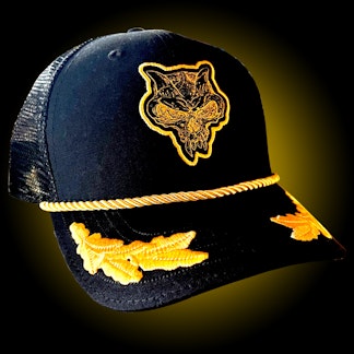black trucker hat with gnarly skull head and feathered bill