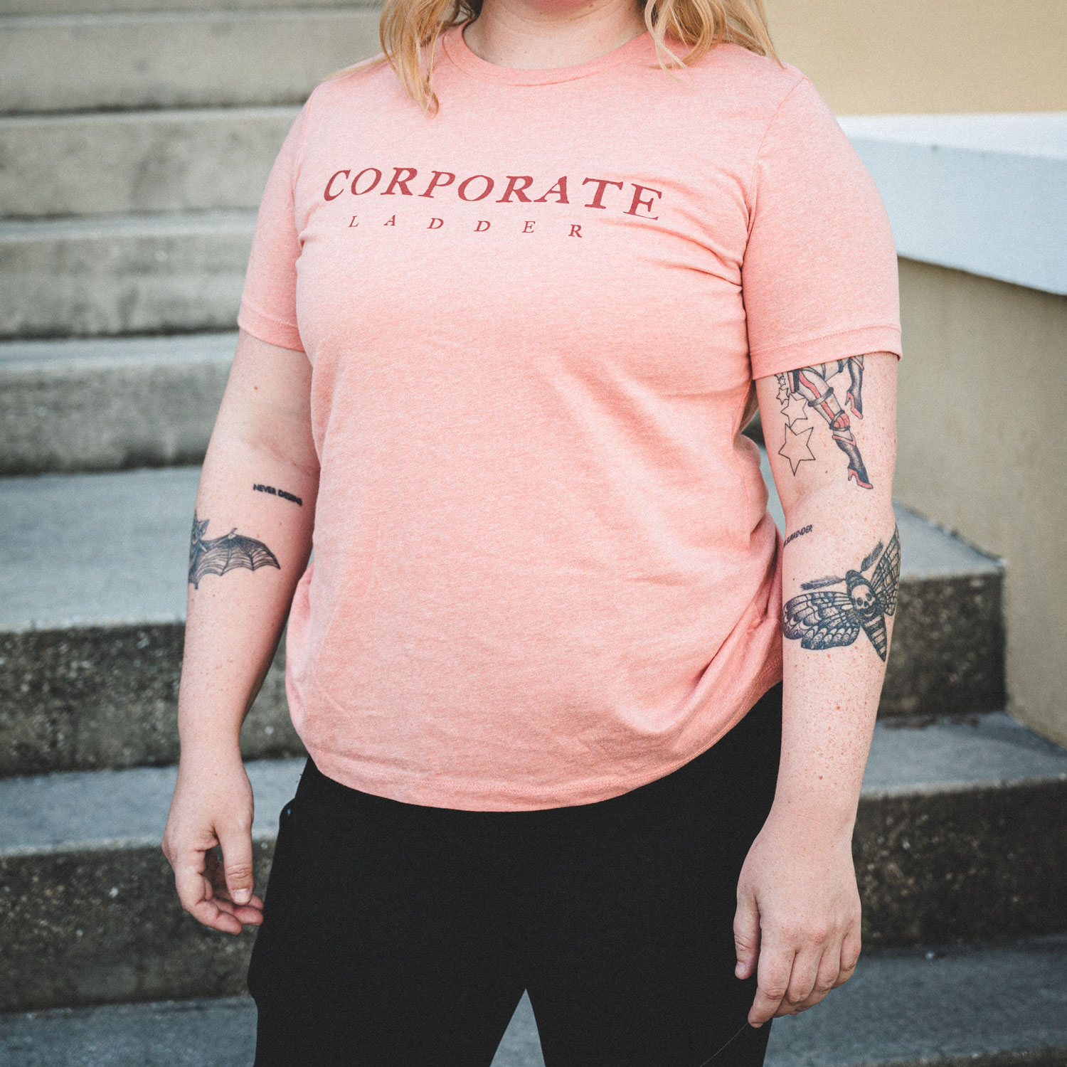 Women's Pink Corporate Ladder Wordmark Shirt with circle ladder logo on back.