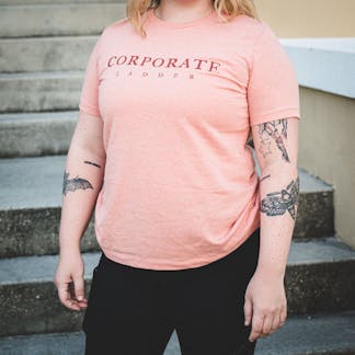 Women's Pink Corporate Ladder Wordmark Shirt with circle ladder logo on back.