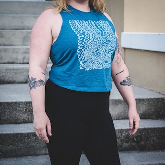 Women’s Teal Crop Top with wavy Corporate Ladder Wordmark.