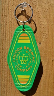 Green Keychain with yellow lettering