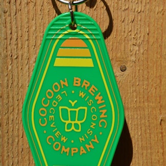 Green Keychain with yellow lettering