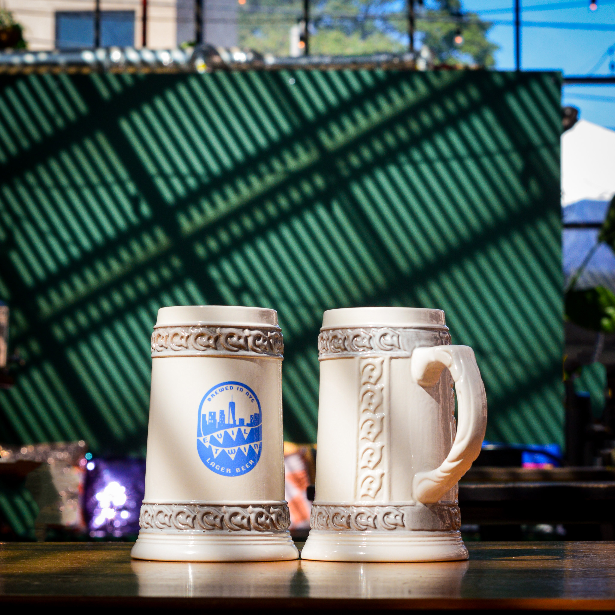ceramic evil twin lager mug in greenhouse