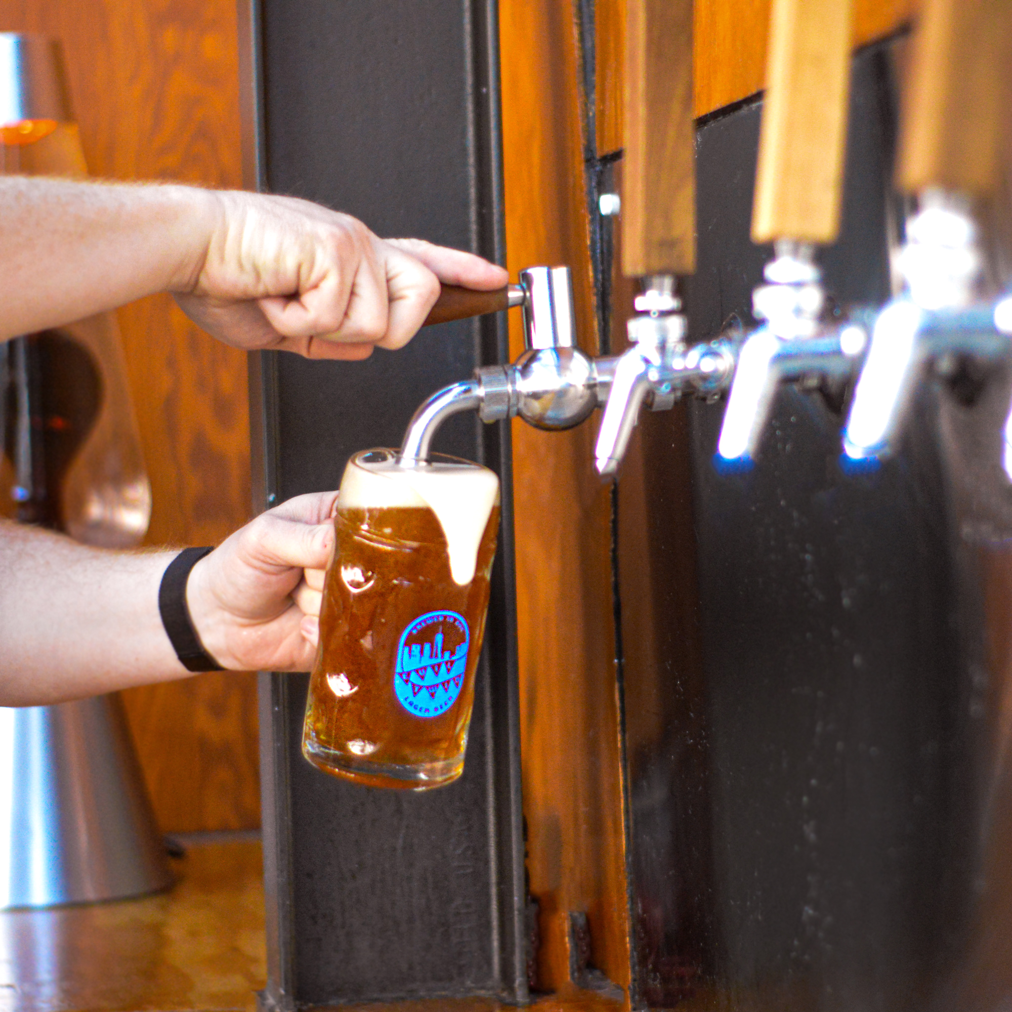 glass mug with Oktoberfest in beer on taps