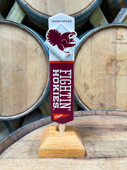 Maroon and white tap handle with the hokie bird on the top