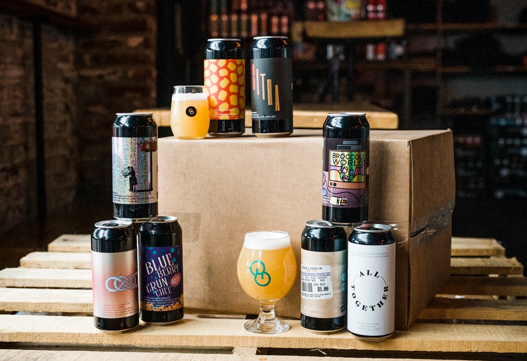 Greatest Hits shipper cans