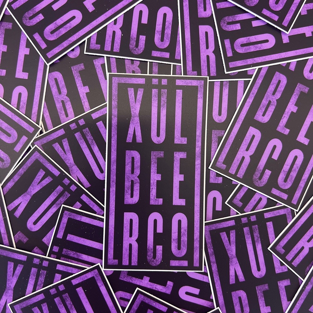 Purple and black sticker with Xul Beer Co. stacked.