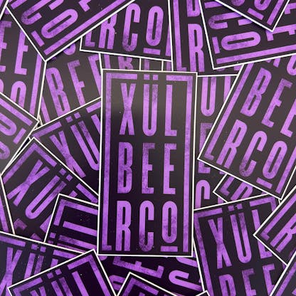 Purple and black sticker with Xul Beer Co. stacked.