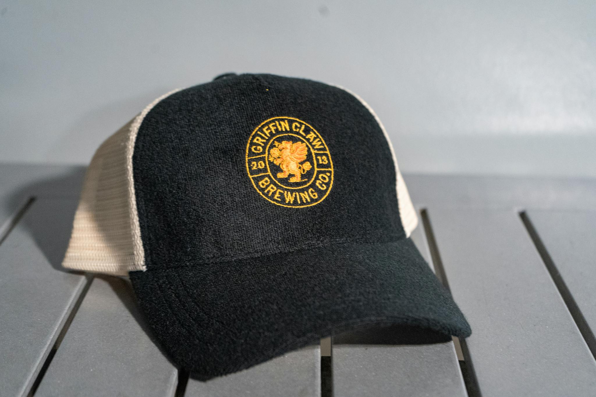 Black/White Terry Trucker Embroidered Logo Hat | Griffin Claw and Blackgrass Cider's Online Shop Black/White Terry Trucker Embroidered Logo Hat | Griffin Claw and Blackgrass Cider's Online Shop