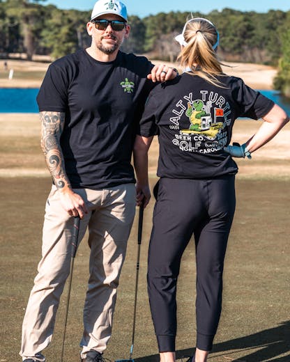 Man and Women posing with Golf Crew Shirt Black