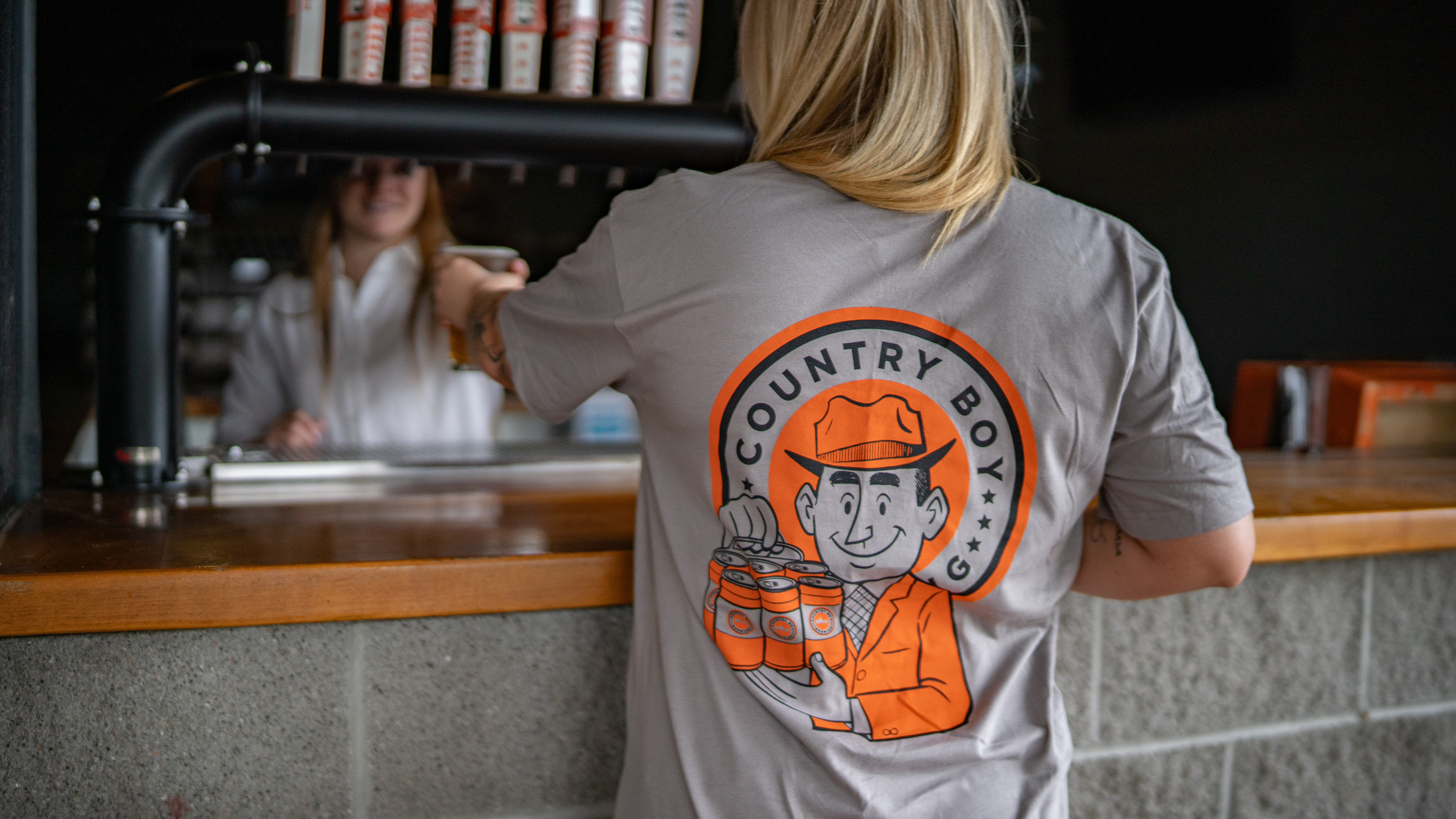 Vintage Salesman Shirt - Holding 6 pack of beer.
