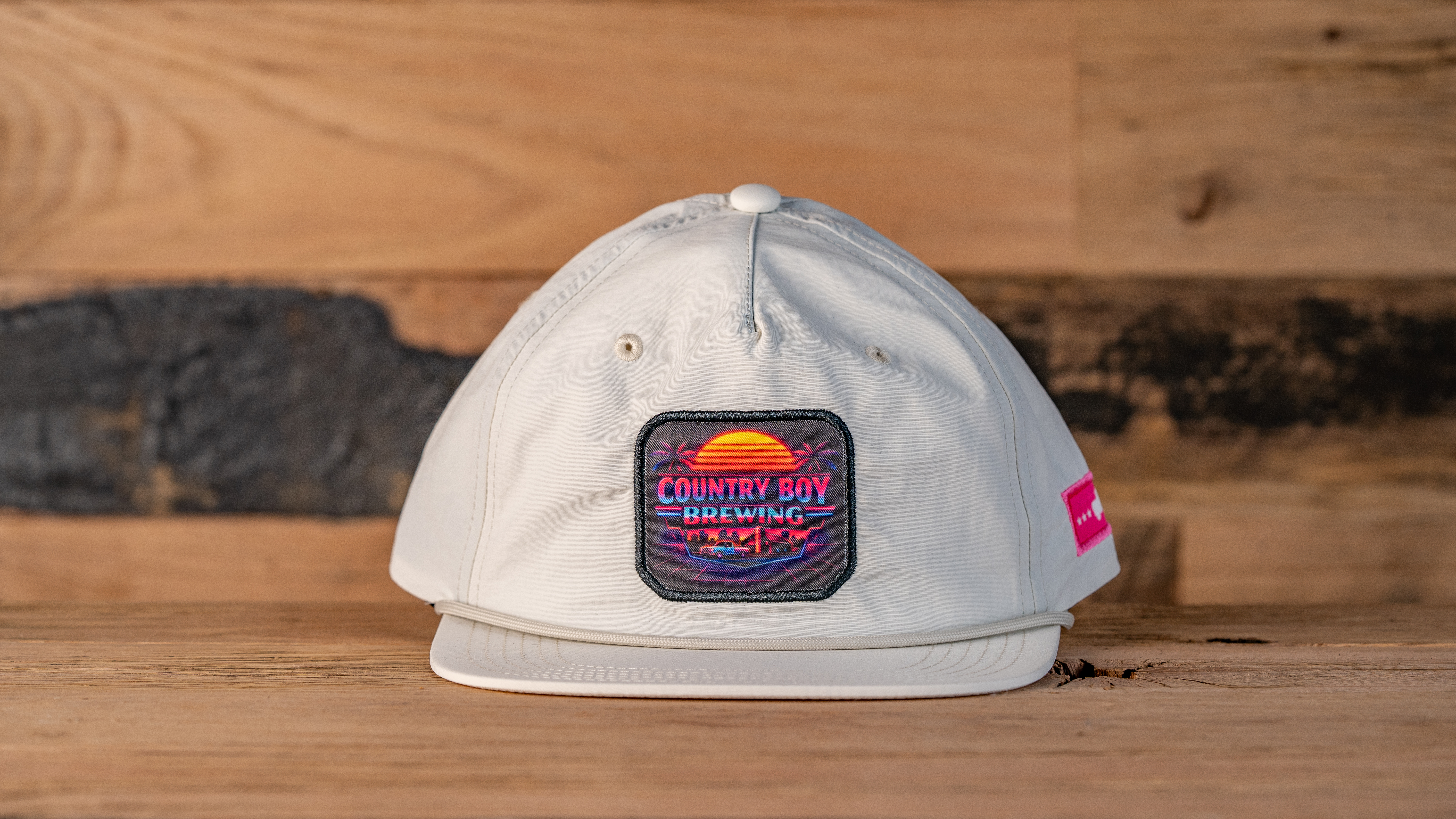 White Beach Hat with Country Boy on background of sun setting on ocean.