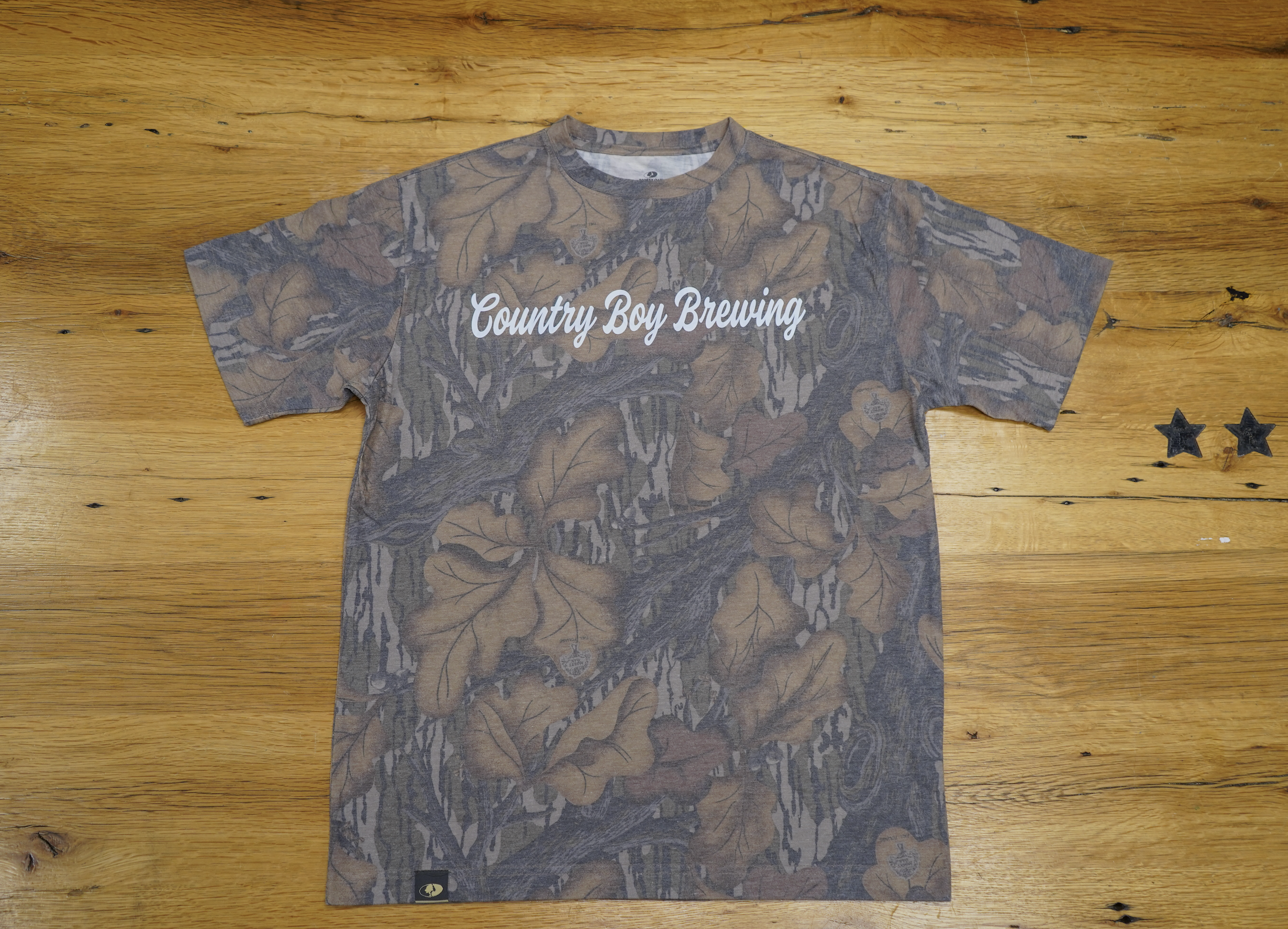 CBB X SLC Camo Tee - Country Boy Brewing written on one side, Mossy Oak Logo on other side.