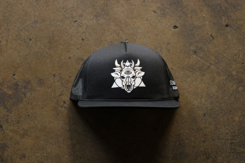 A black "trucker-style" hat. The front of the hat has the Sideward logo which resembles a many horned demon cow skull with a triangle and circle behind it.