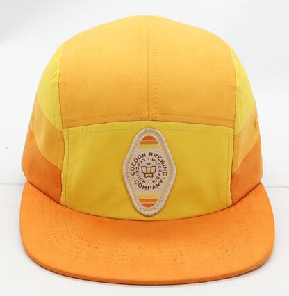 Orange flat brim hat with keychain logo