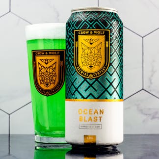 Ocean blast can with a pint filled with ocean blast behind
