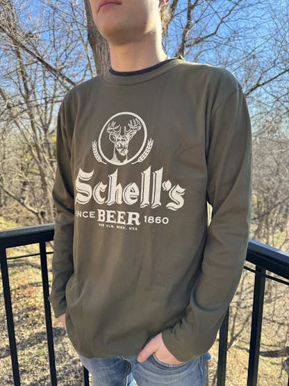 Olive color crew with Schell logo on front.