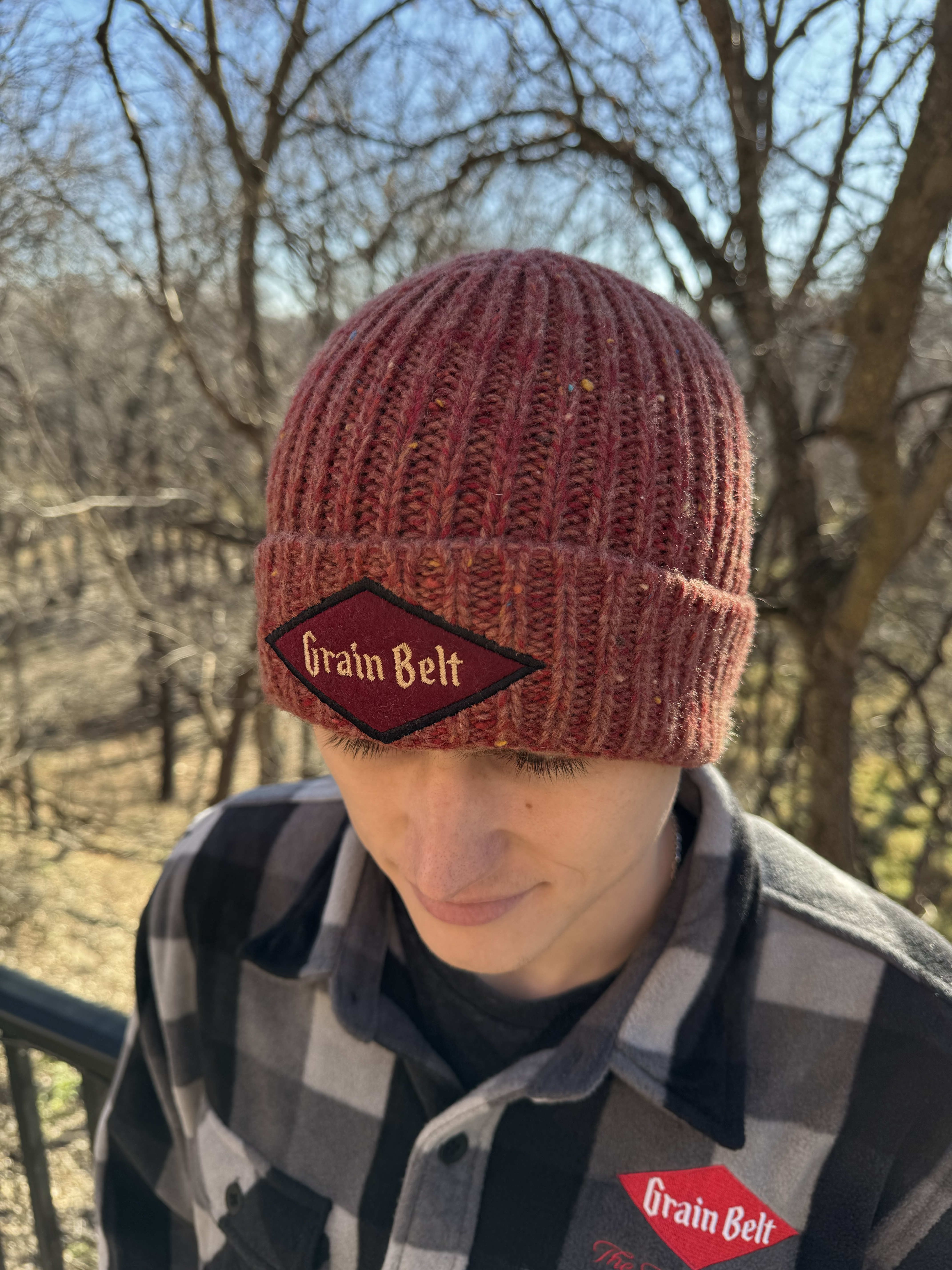 Red fleck stocking cap with Grain Belt patch on front.