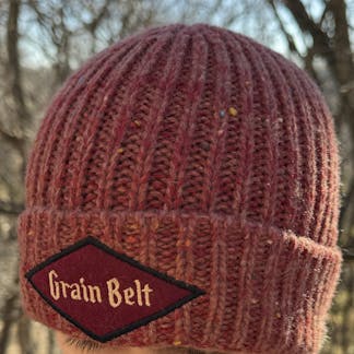 Red fleck stocking cap with Grain Belt patch on front.
