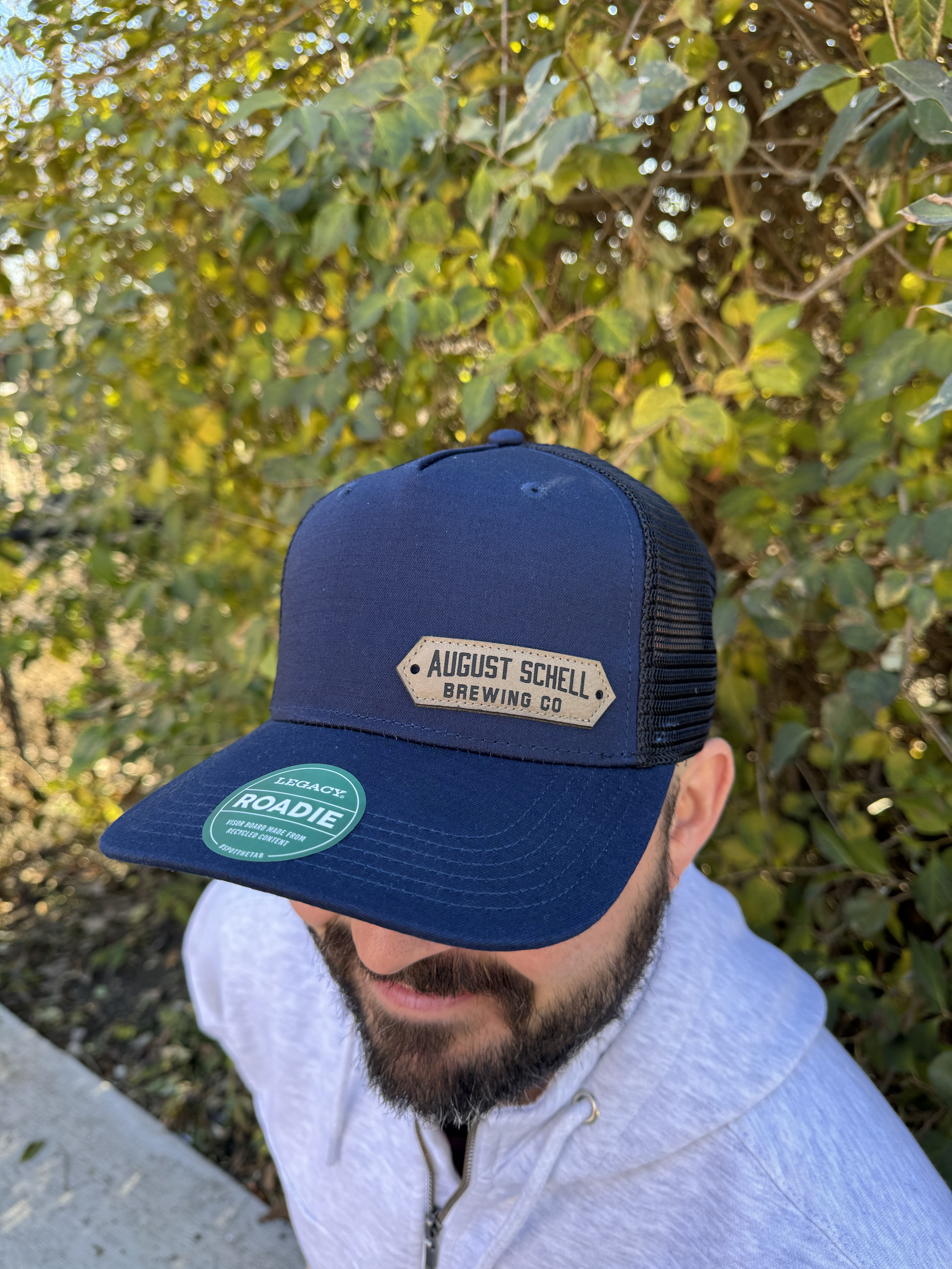 Navy blue baseball hat with Schell patch on front.