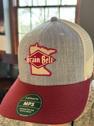 Grey and red baseball hat with Grain Belt Minnesota patch on front.