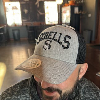 Grey and black baseball cap that says Schells