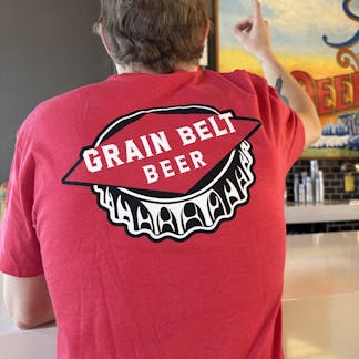 Red T-shirt with Grain Belt bottle cap logo on front and back.