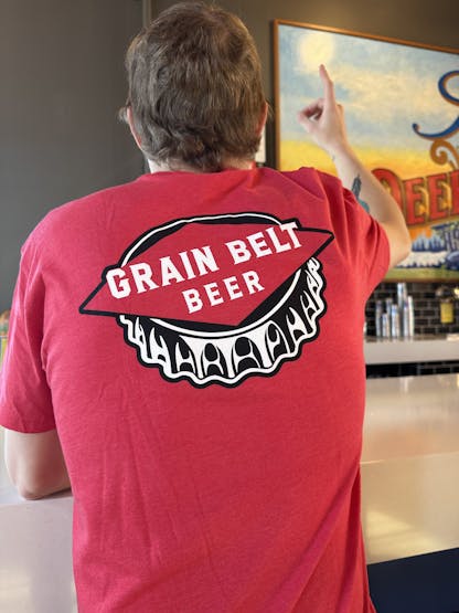 Red T-shirt with Grain Belt bottle cap logo on front and back.