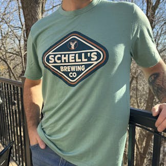 Seafoam green T-shirt with Schell logo on front.