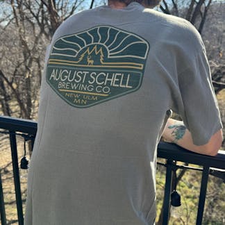 Olive colored t-shirt with Schell logo on front and back.