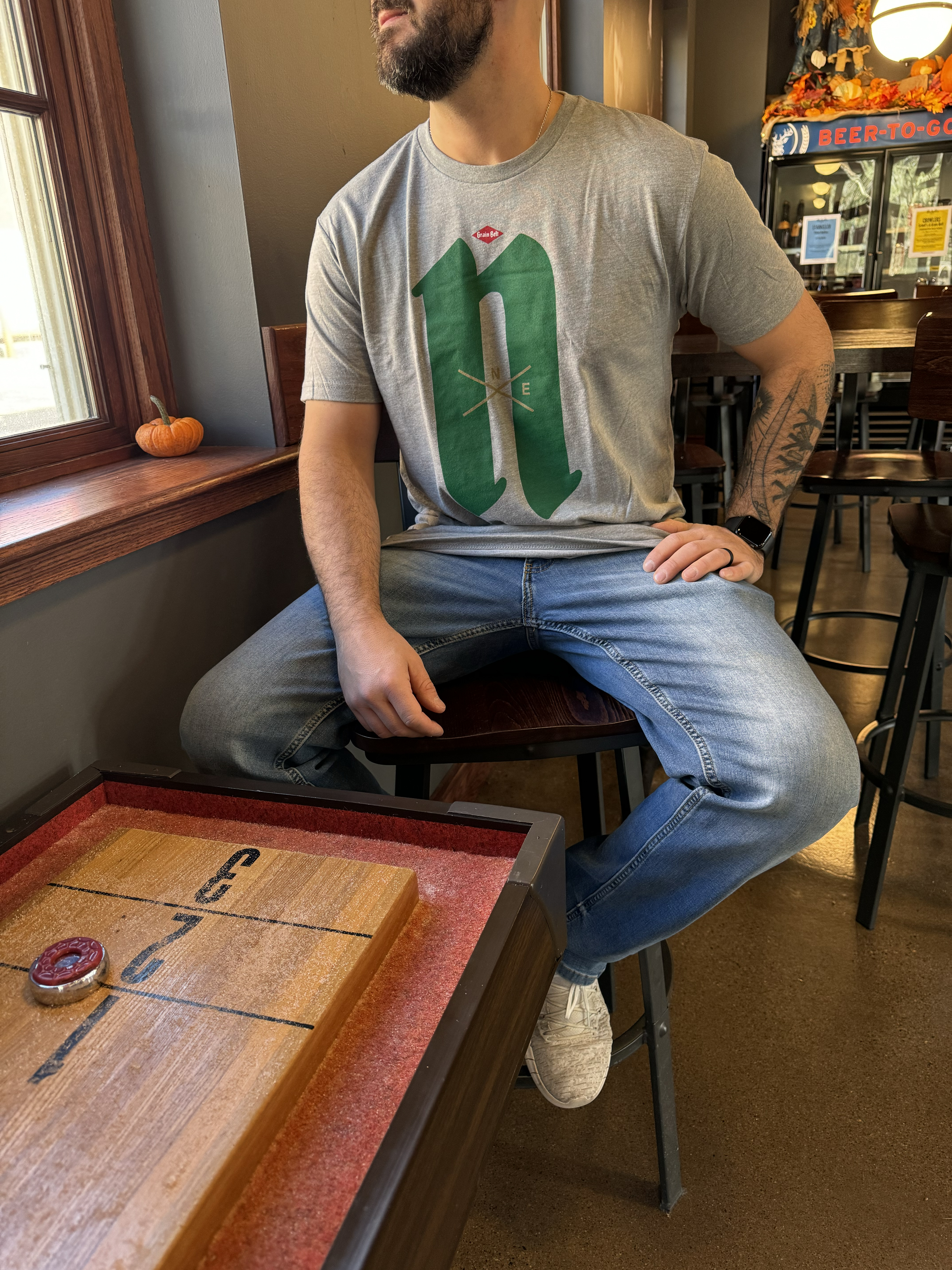 Grey T-shirt with Nordeast logo on front.