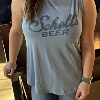 Blue tank top with Schell logo on front.
