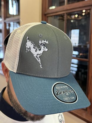 Blue, grey and white baseball hat with Deer on front.