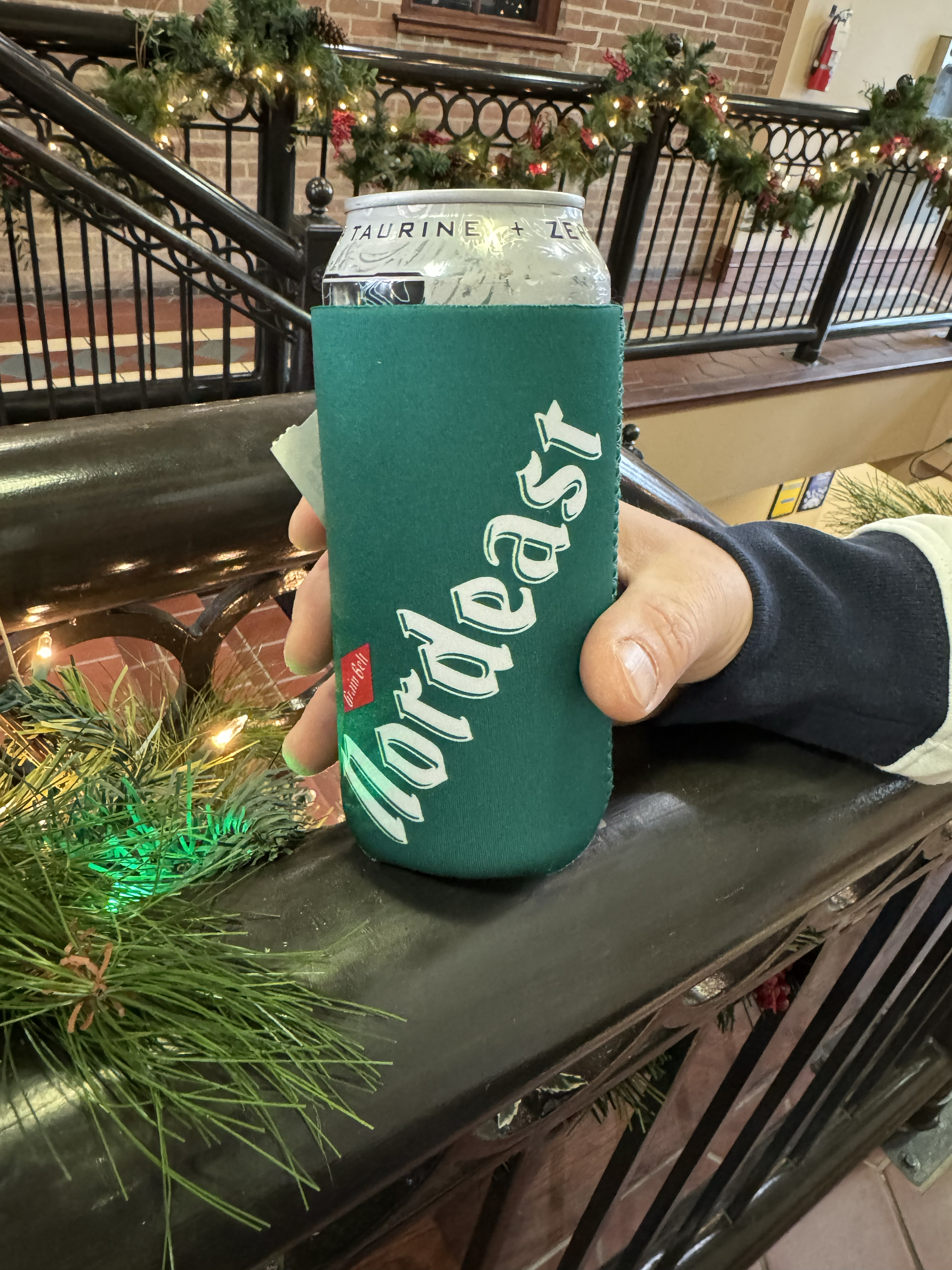 Green can coozie with nordeast logo.