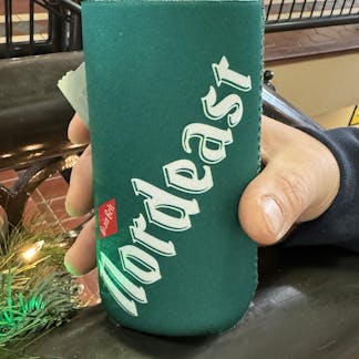 Green can coozie with nordeast logo.