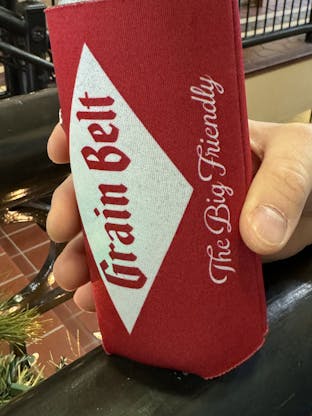Red can coozie with Grain Belt logo on both sides.
