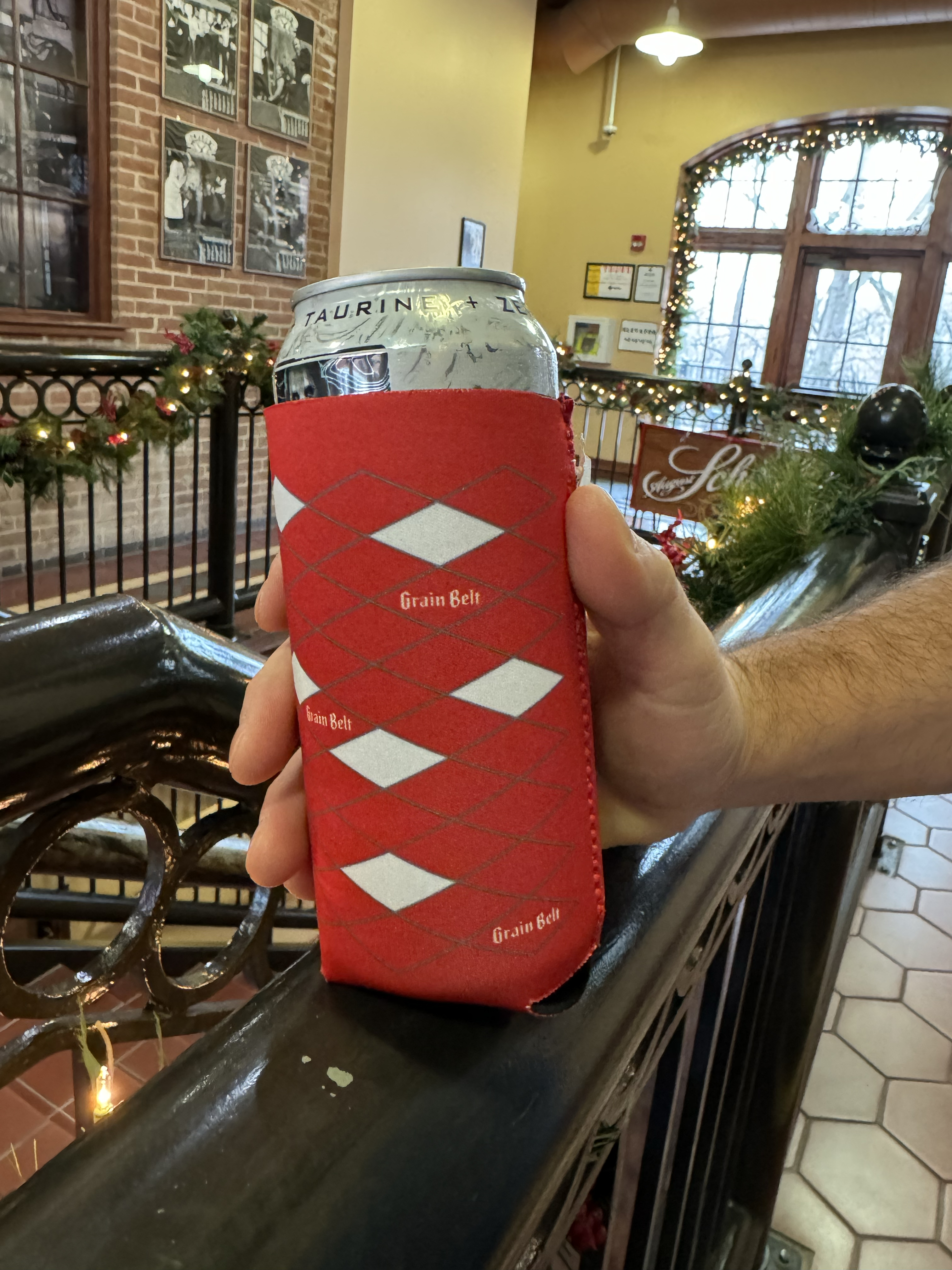 Red can coozie with Grain Belt diamond logos wrapper around sides.