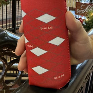 Red can coozie with Grain Belt diamond logos wrapper around sides.