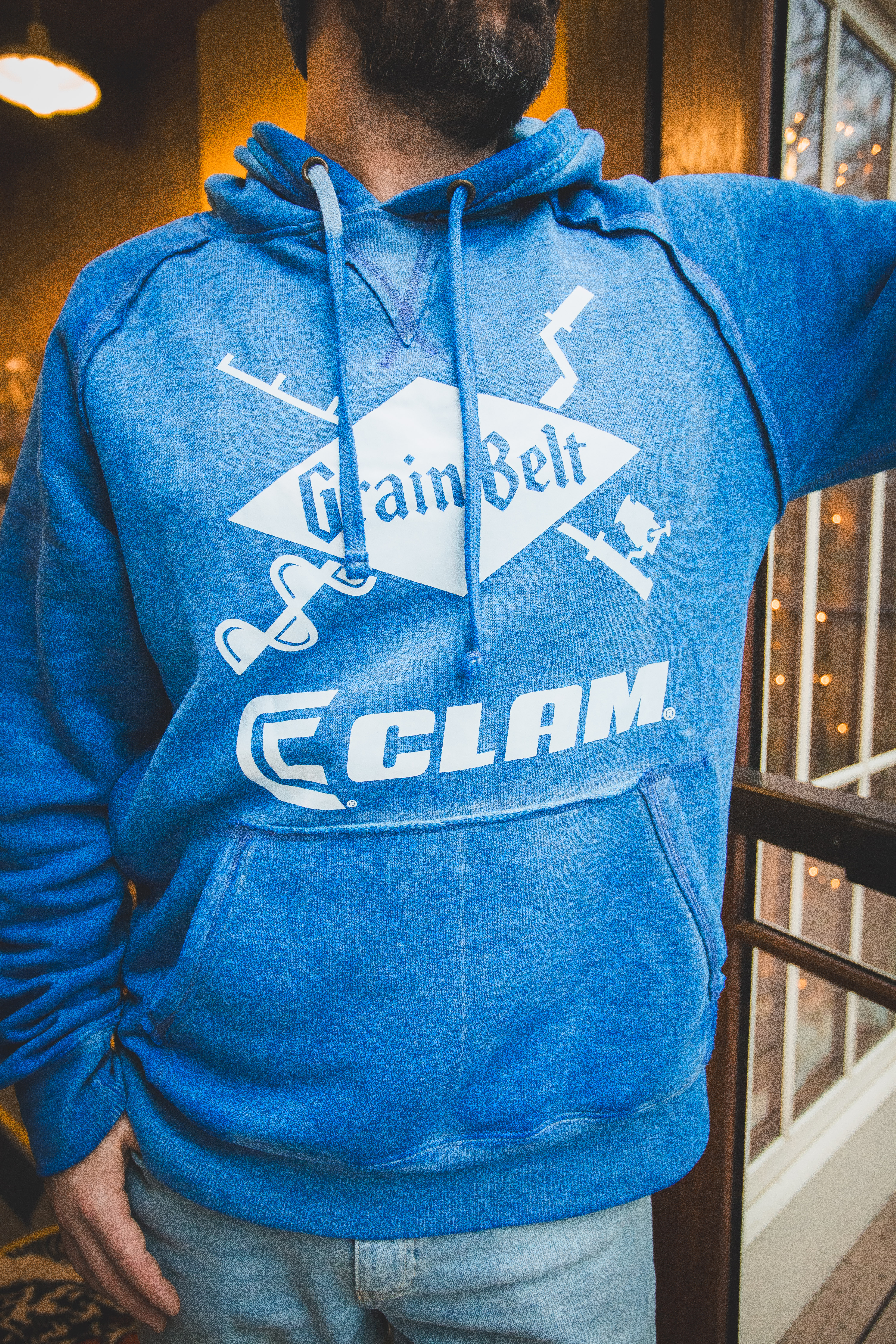 Blue hooded sweatshirt with Grain Belt and Clam logo on front.