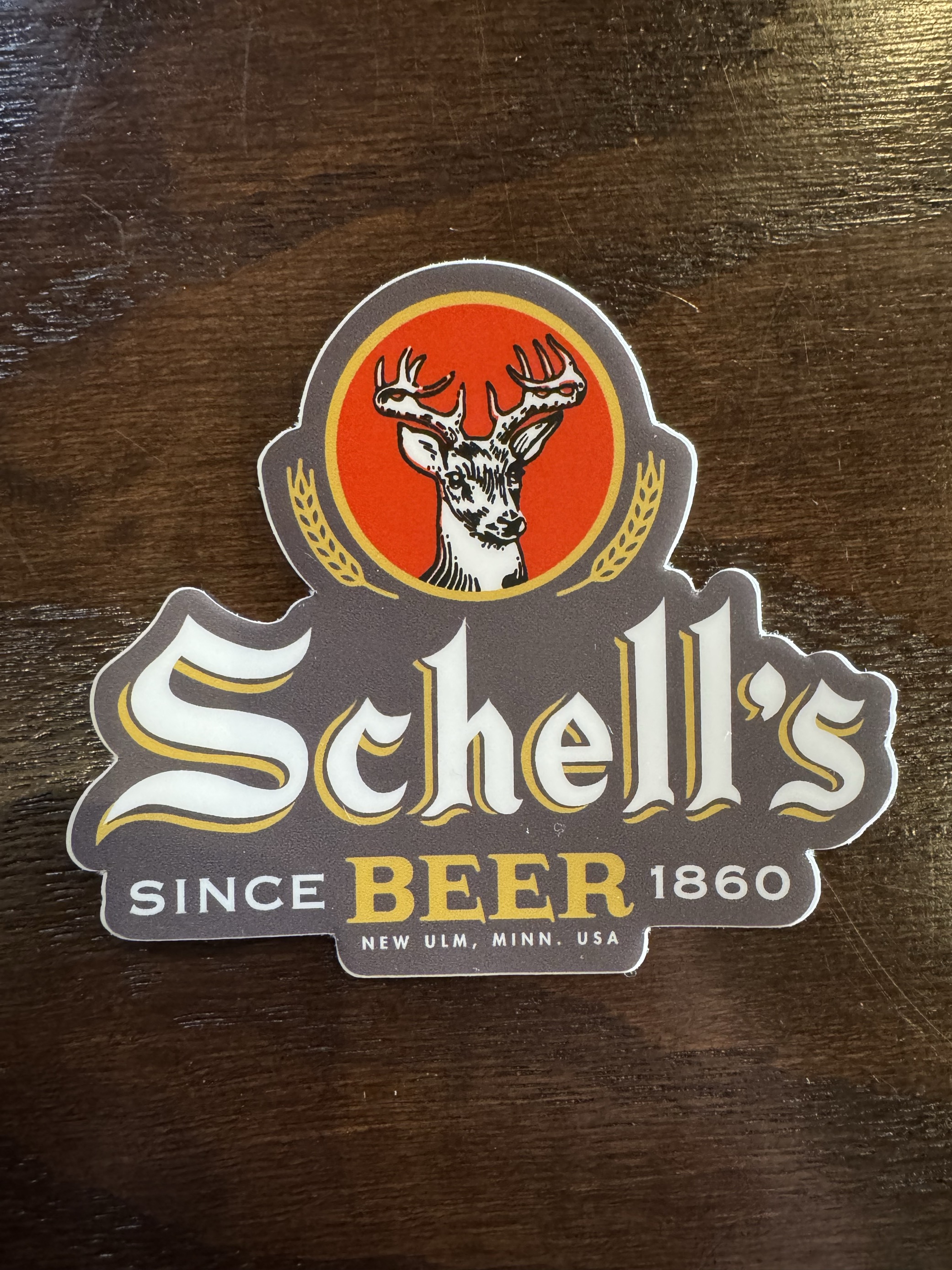 Schell red and black diecut sticker 3" by 2.57"