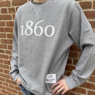 Dark grey crew neck sweatshirt with "1860" in white on front with a patch on the lower left.