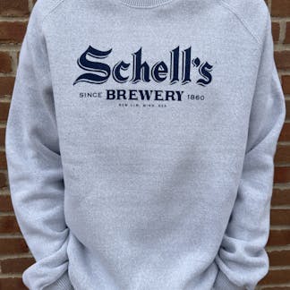 Steel grey crew neck sweatshirt with navy Schell logo on front.