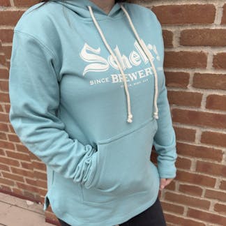 Blue colored hooded sweatshirt with Schell logo on front.