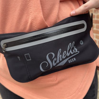 Black waist pack with Schell logo on front.