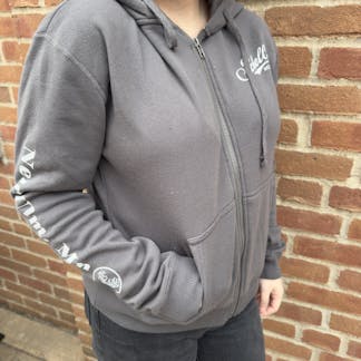 Dark grey full zip hooded sweatshirt with Schell logo on left lapel.