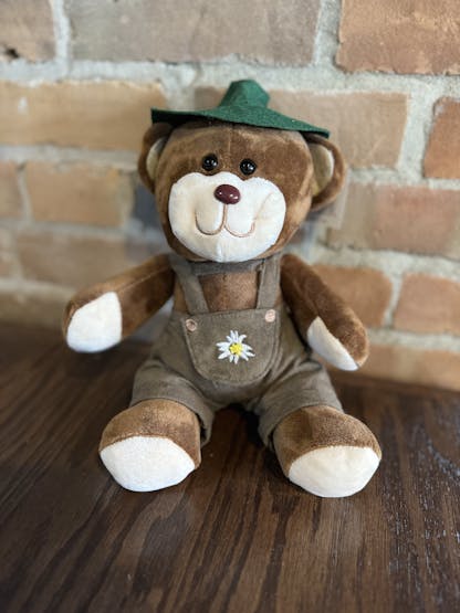 Bear stuffed animal wearing lederhosen.