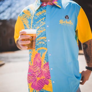 Gold and blue Hawaiian style shirt with Schell logo on left lapel.